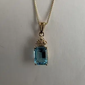 YG 14k Diamond Blue Topaz pendant